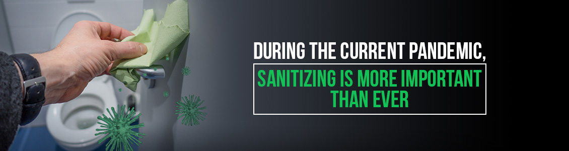 An Image Depicting Man Wiping and Sanitizing Stall Handle Which is Important During a Pandemic